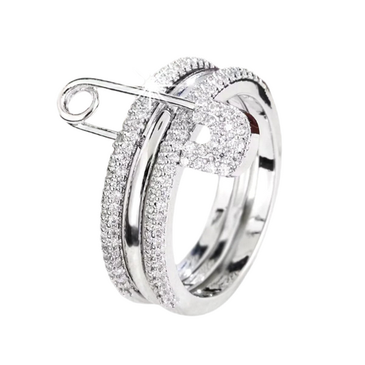 Silver triple ring with safety pin design. Glamorous shimmering cubic zirconia.