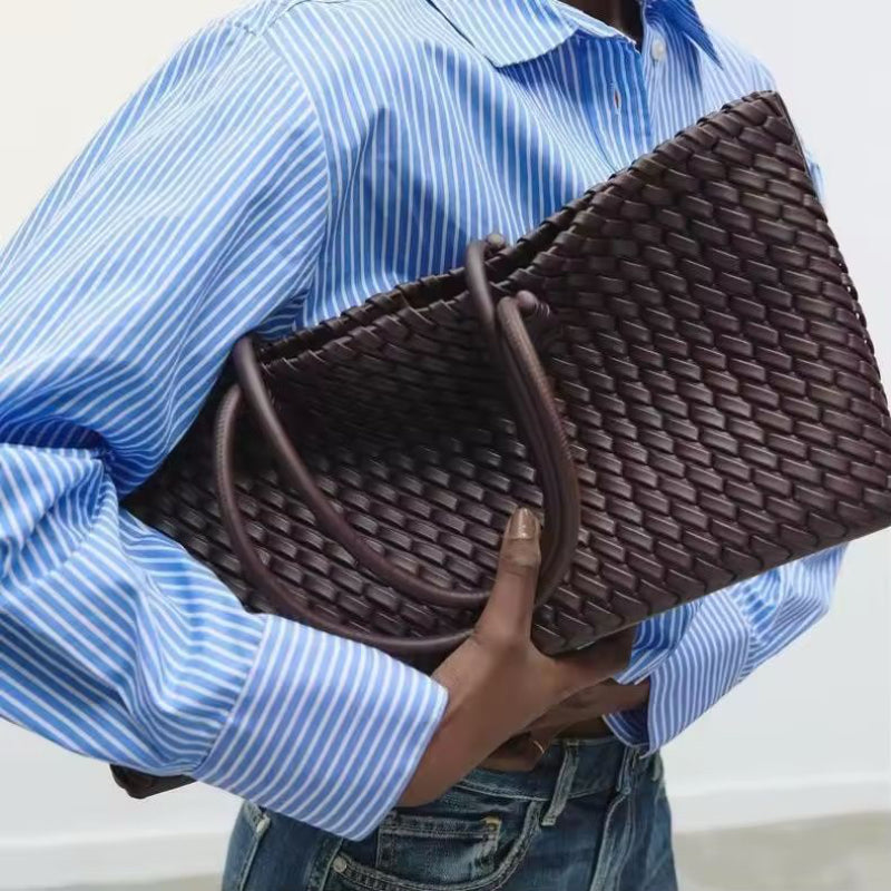 Elegant large brown women’s handbag with woven texture and sturdy double handles
