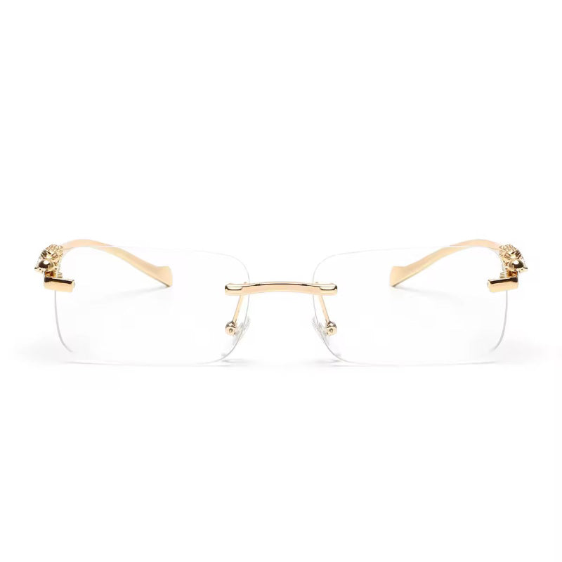 Clear rimless fashion sunglasses with gold metal panther arms and rectangular lenses
