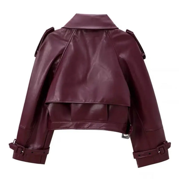 Burgundy vegan leather jacket for women with wide lapel, epaulettes, waist belt, and breathable lining, perfect for sustainable fashion.