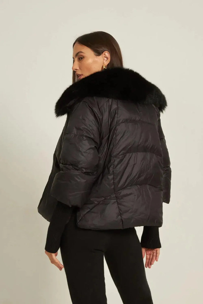 Model wearing Maison de Fox luxury women’s down jacket with real fox fur collar – stylish winter fashion look