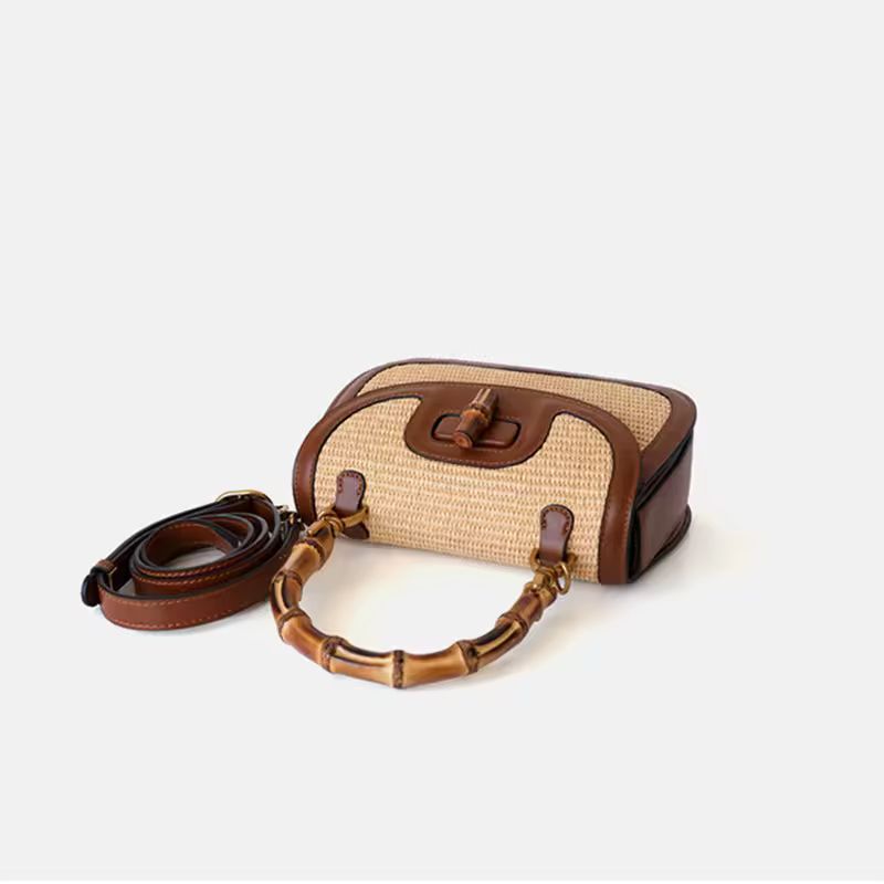 Side view of small bamboo handle handbag made from natural straw and genuine cowhide leather, adjustable shoulder strap, high-quality summer handbag for women – perfect everyday purse with boho style and luxury finish.
