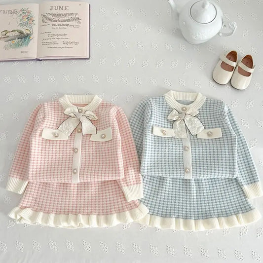 Charming girls’ spring outfit set made from cotton, polyester, and acrylic blend. Featuring a classic O-neck, full-length sleeves, and timeless plaid pattern. Available for kids aged 1-3 years, perfect for everyday wear or special occasions. Stylish and comfortable kids clothing in two beautiful colors.