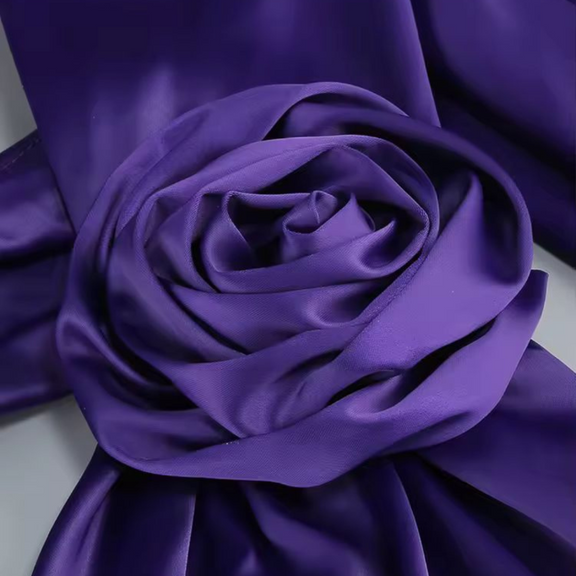 Purple satin evening gown with floral shoulder detail, sleeveless and floor-length – Glamour Mia
