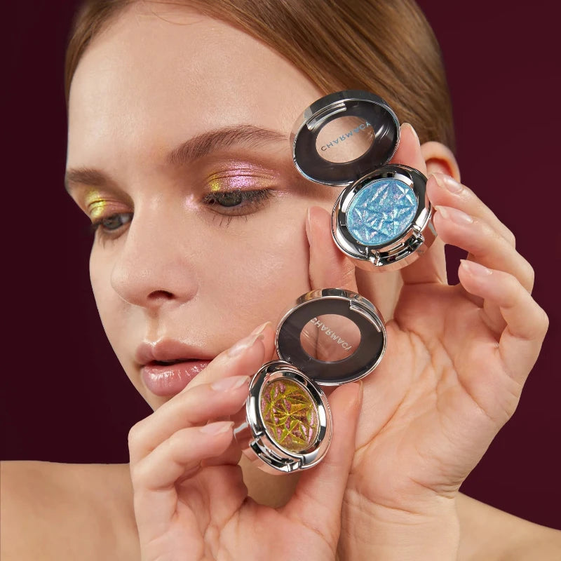 Woman applying vibrant colors from Duochrome Eyeshadow Palette