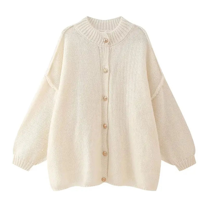 Elegant gold button cardigan made from lightweight, stretchy fabric, perfect for stylish occasions like Malta nights. Comfortable, versatile, and chic.