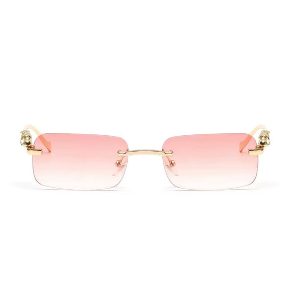 Rose gold rimless sunglasses with gradient lenses and luxury gold panther arms

