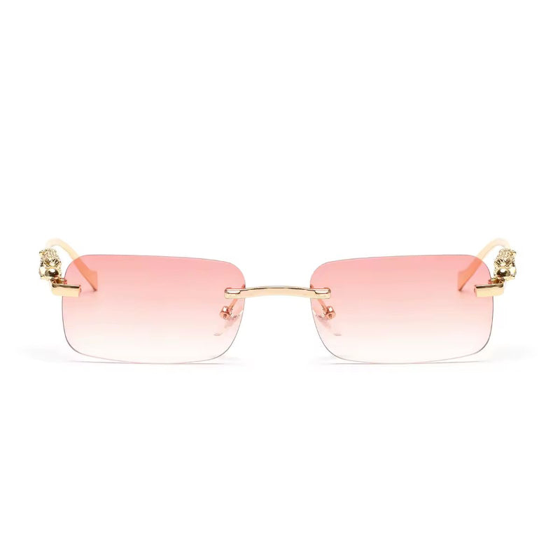 Rose gold rimless sunglasses with gradient lenses and luxury gold panther arms
