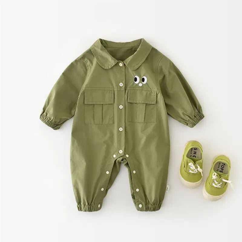 Chic Charm green baby overall with pockets and eye details – soft 100% cotton, hooded, snap button closure, perfect for babies and toddlers.”