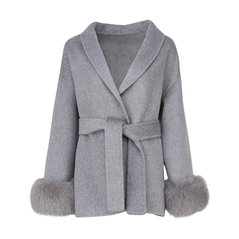 Close-up of removable fur cuffs on Guardian Shearling Jacket, showcasing elegant design and high-quality materials for fashionable outerwear.
