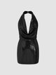 Model wearing a black sequin halterneck mini dress with deep V neckline and bodycon fit – perfect for parties or night out fashion.
