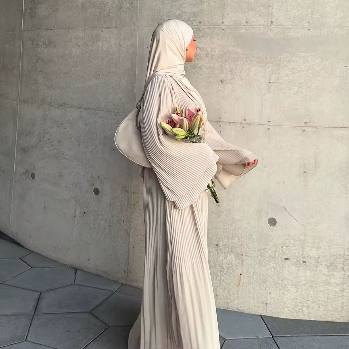 Elegant Eid Muslim dress for women, pleated flare sleeve Kaftan, modest fashion for Ramadan, special occasions, and Islamic holidays, made from soft polyester fabric, V-neckline, long sleeve, regular fit, and stylish Jalabiya design.