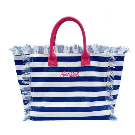 Extra-large Saint Barth canvas beach bag for women with boho fringe and summer script, oversized and handcrafted look.
