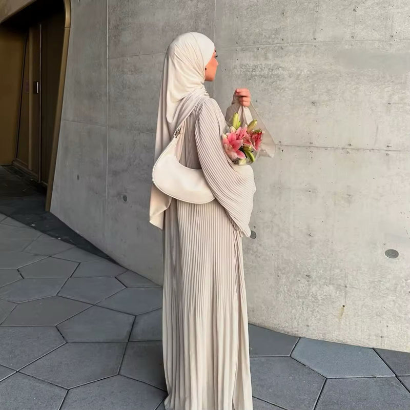 Elegant Eid Muslim dress for women, pleated flare sleeve Kaftan, modest fashion for Ramadan, special occasions, and Islamic holidays, made from soft polyester fabric, V-neckline, long sleeve, regular fit, and stylish Jalabiya design.