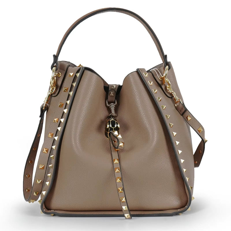 Trendy bucket bag made from genuine cowhide leather with studded details. Beige