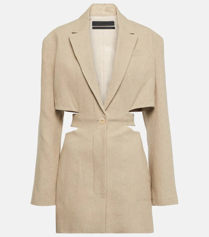 Woman wearing a beige cut-out blazer dress with V-neck, long sleeves, and tailored fit. Side cut-outs and single-button closure complete the chic design.
