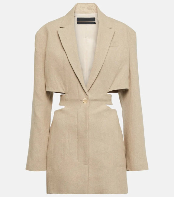 Woman wearing a beige cut-out blazer dress with V-neck, long sleeves, and tailored fit. Side cut-outs and single-button closure complete the chic design.
