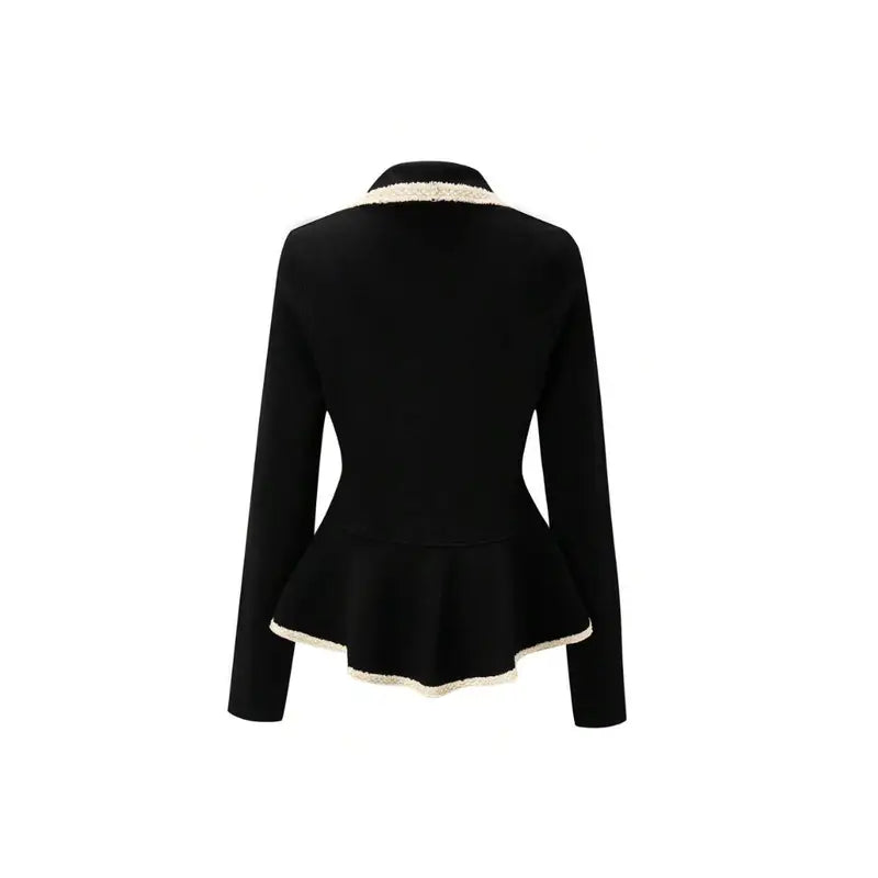 Chic black long sleeve top with V-neck, ruffle accents, and contrast cuffs – elegant and feminine.