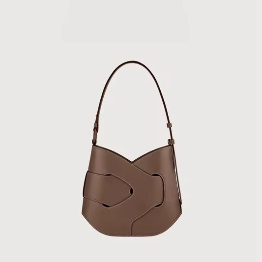 Luxury women’s leather handbag with adjustable strap – Axis crossbody bag in black and taupe