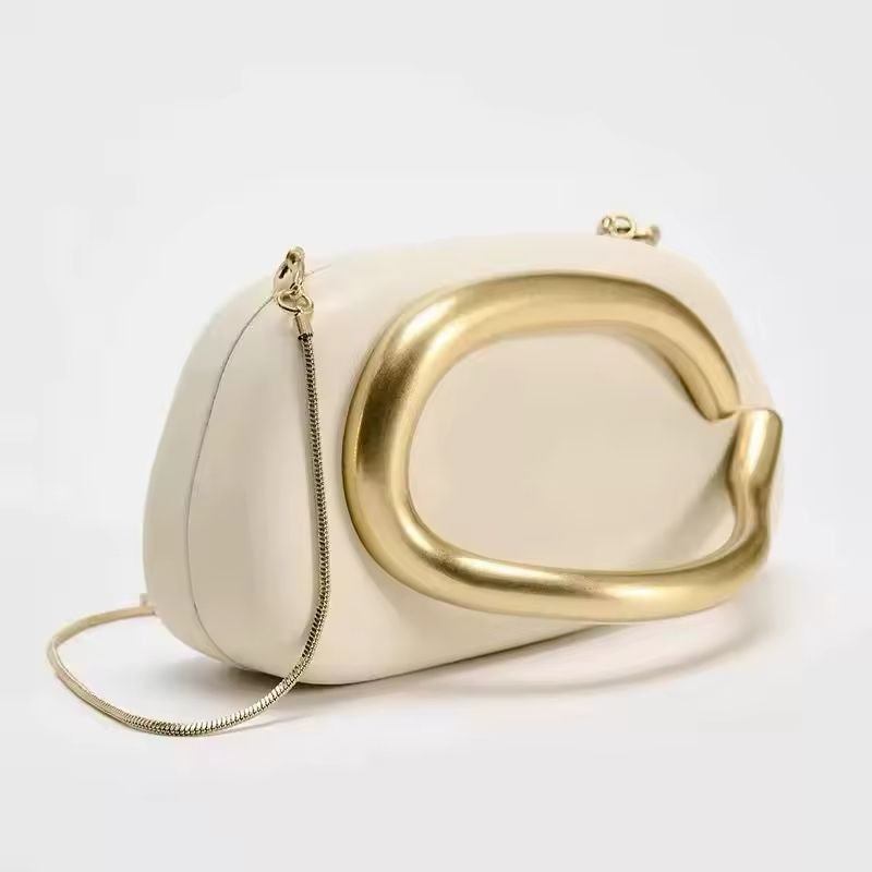 Luxurious women’s handbag in brown PU leather with elegant gold metal details and chain strap – perfect for evening wear, parties, weddings, or upscale everyday fashion.