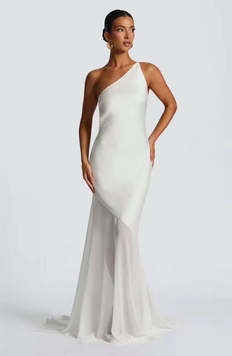 Elegant ivory white formal gown with asymmetrical neckline and body-hugging silhouette for events
