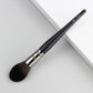 Makeup brush with an elegant design featuring a wooden handle and high-quality hairs for perfect makeup applications. Ideal for blusher, concealer, and eyeshadow.