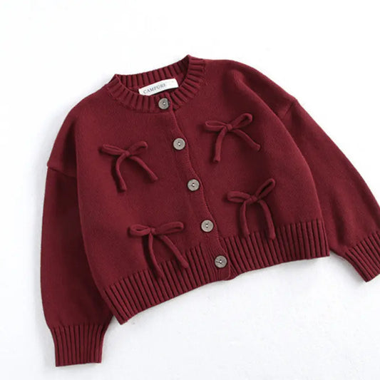 Stylish maroon cotton cardigan for girls, featuring O-neck, long sleeves, ribbed cuffs, and brown buttons. Perfect for fall and winter, available for girls aged 1-6 years in sizes 80-130 cm. Comfortable and fashionable kids’ clothing for cold weather.