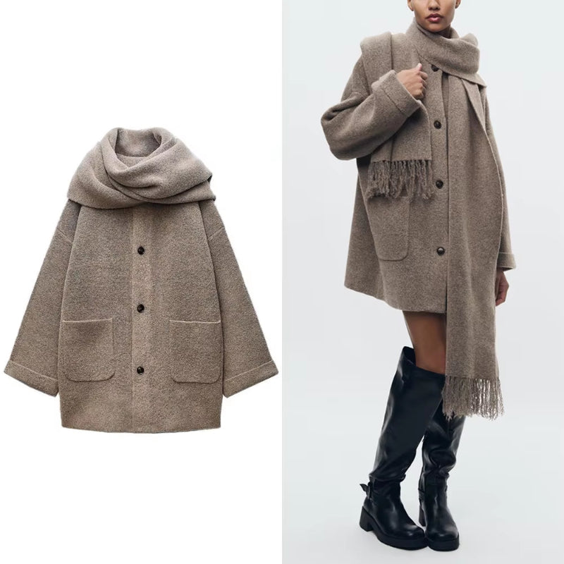 Elegant beige wool blend coat with attached scarf, single-breasted design and oversized silhouette for fall winter 2025.