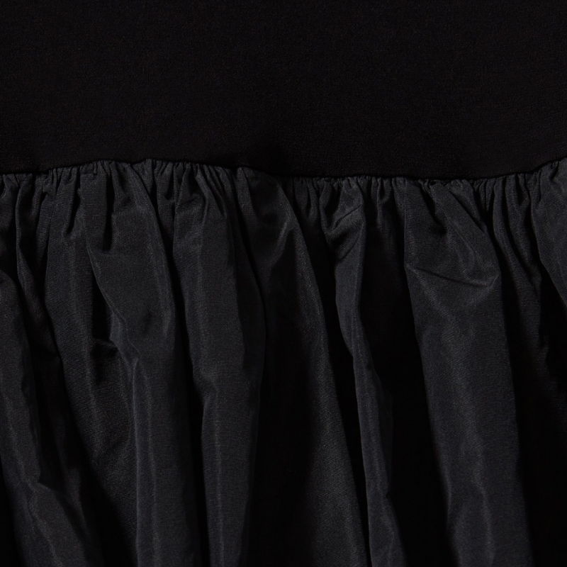 Elegant long sleeve black dress for women with voluminous balloon skirt, sculptural silhouette, and fitted top – minimalist couture-inspired eveningwear made in Italy.
