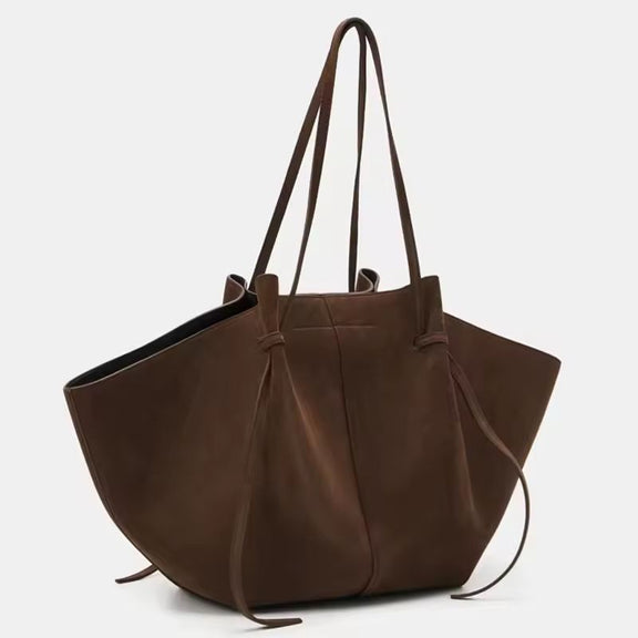 Side and detail view of Milano Luxe Suede Tote in rich brown vegan suede, showcasing stitching and knot handle design
