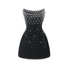 Éclat de Lune black mini dress with crystal embellishment and strapless hourglass silhouette.
