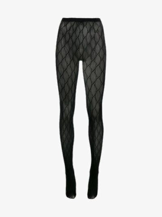 Close-up of black monogram mesh pattern on fine fishnet fabric — elegant and sophisticated design.
