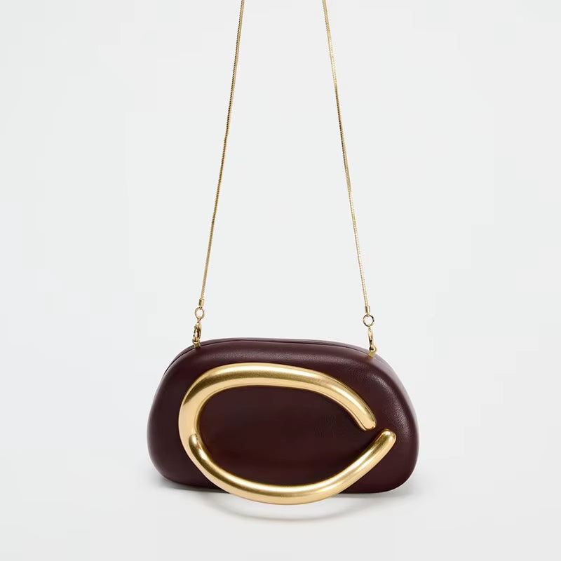 Luxurious women’s handbag in brown PU leather with elegant gold metal details and chain strap – perfect for evening wear, parties, weddings, or upscale everyday fashion.