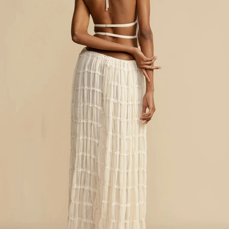 Boho-chic Ibiza dress – 2-piece summer outfit with a flowy pleated maxi skirt and backless halter top, perfect for beach vacations, weddings & festivals.