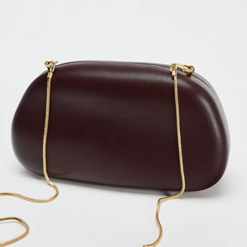 Luxurious women’s handbag in brown PU leather with elegant gold metal details and chain strap – perfect for evening wear, parties, weddings, or upscale everyday fashion.