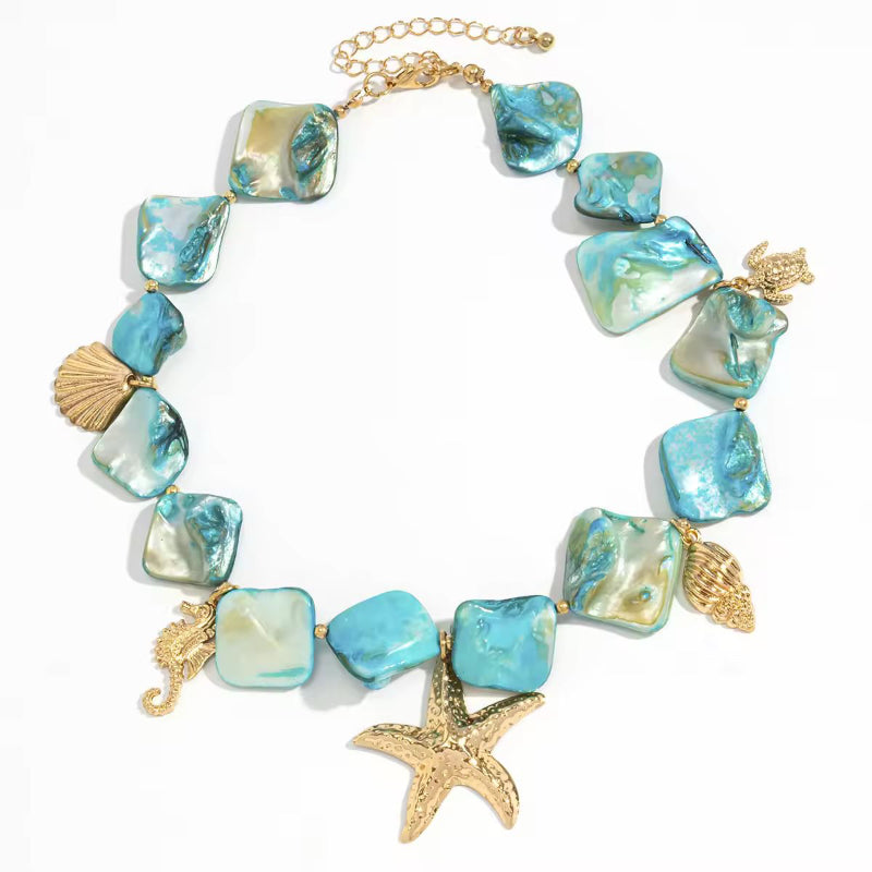 Boho ocean charm necklace with starfish, turtle, shell, and seahorse pendants – Mira del Mar summer jewelry for women
