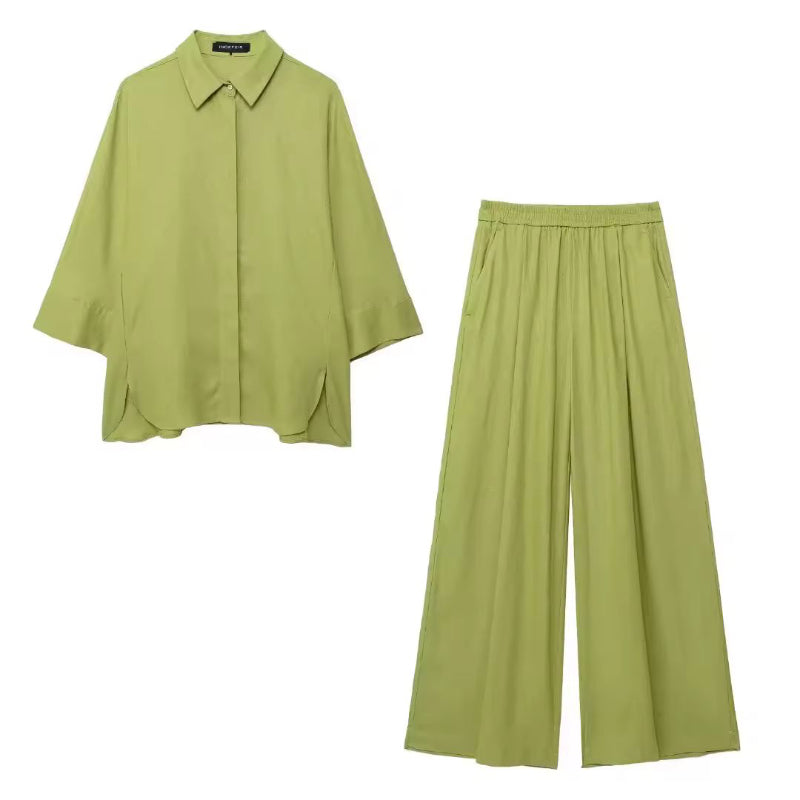 Olive green 2-piece women’s set with wide-leg trousers and flowy shirt – lightweight polyester, ideal for casual or elevated everyday looks.
