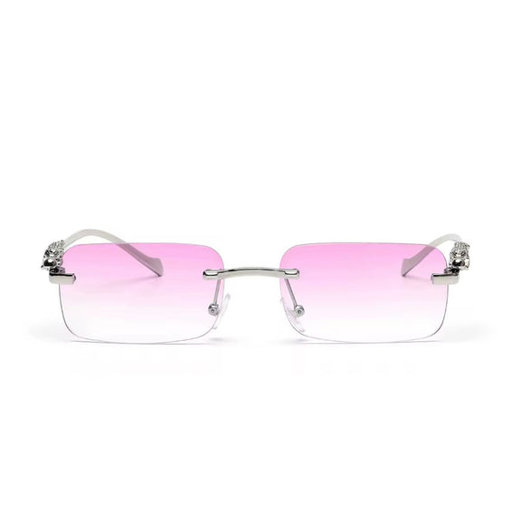 Rose gold rimless sunglasses with gradient lenses and luxury gold panther arms
