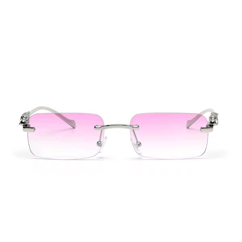 Rose gold rimless sunglasses with gradient lenses and luxury gold panther arms
