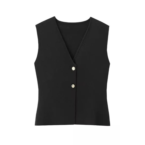 Paris City Muse black elegant two-piece outfit – sleeveless vest with gold accents and long pleated maxi skirt – perfect for evening events and city strolls.
