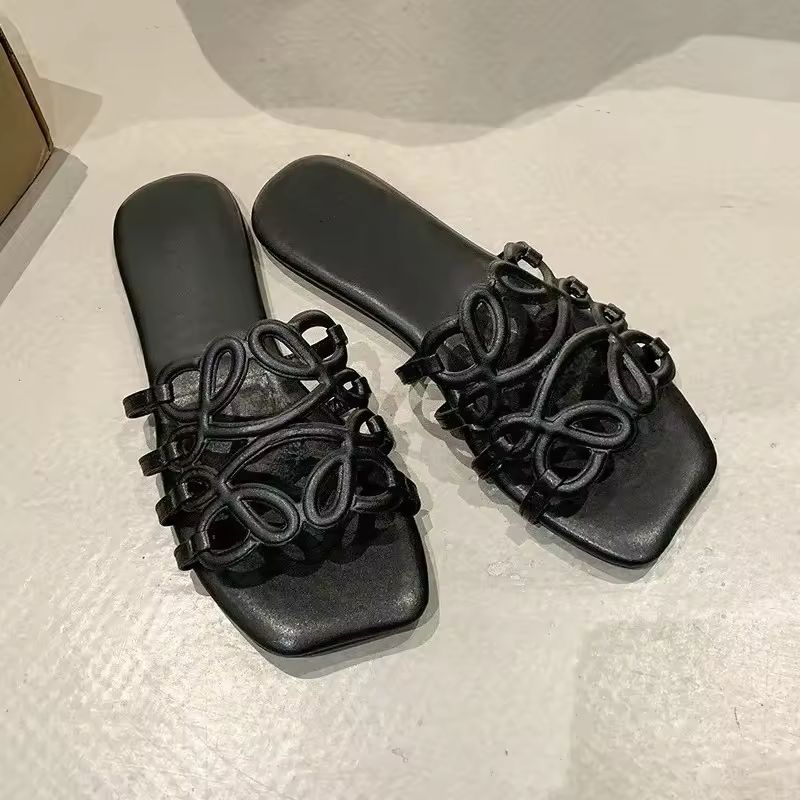 ALMA black PU leather slide sandals with artistic strap and 1–3 cm heel – stylish flat shoes for women
