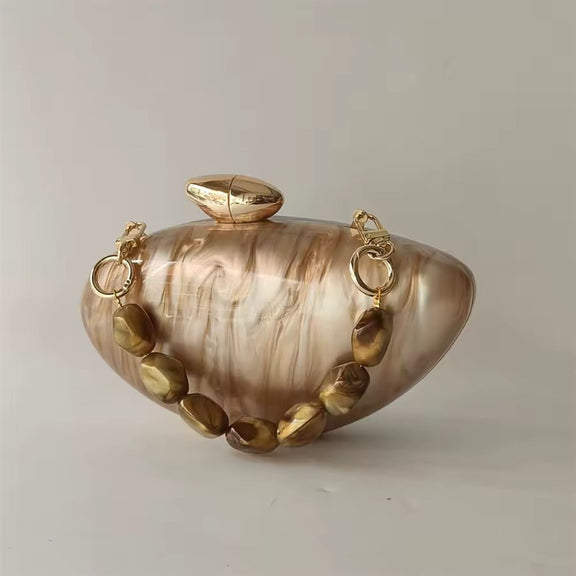 Elegant hard case clutch in pearl brown marble acrylic with gold-toned clasp and decorative bead handle.