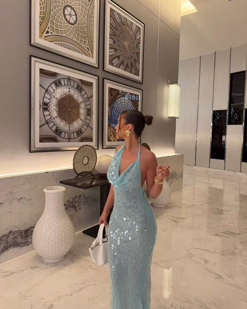 Elegant sequin maxi dress with waterfall neckline and open back, Formentera-inspired summer gown.
