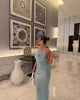 Elegant sequin maxi dress with waterfall neckline and open back, Formentera-inspired summer gown.
