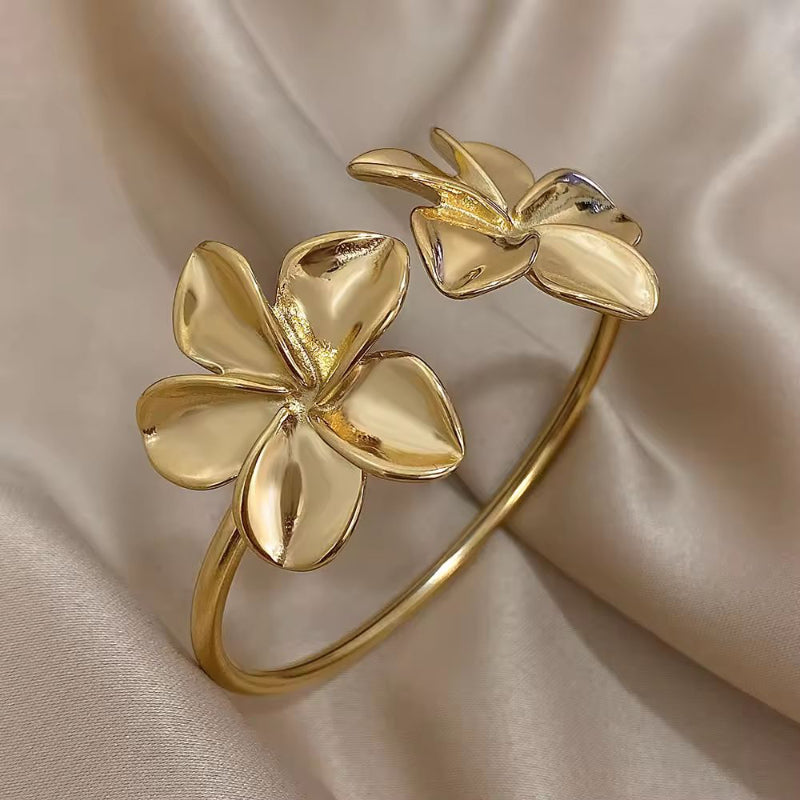 Gold waterproof floral cuff bracelet for women with sculpted flower ends – stainless steel elegant jewelry piece
