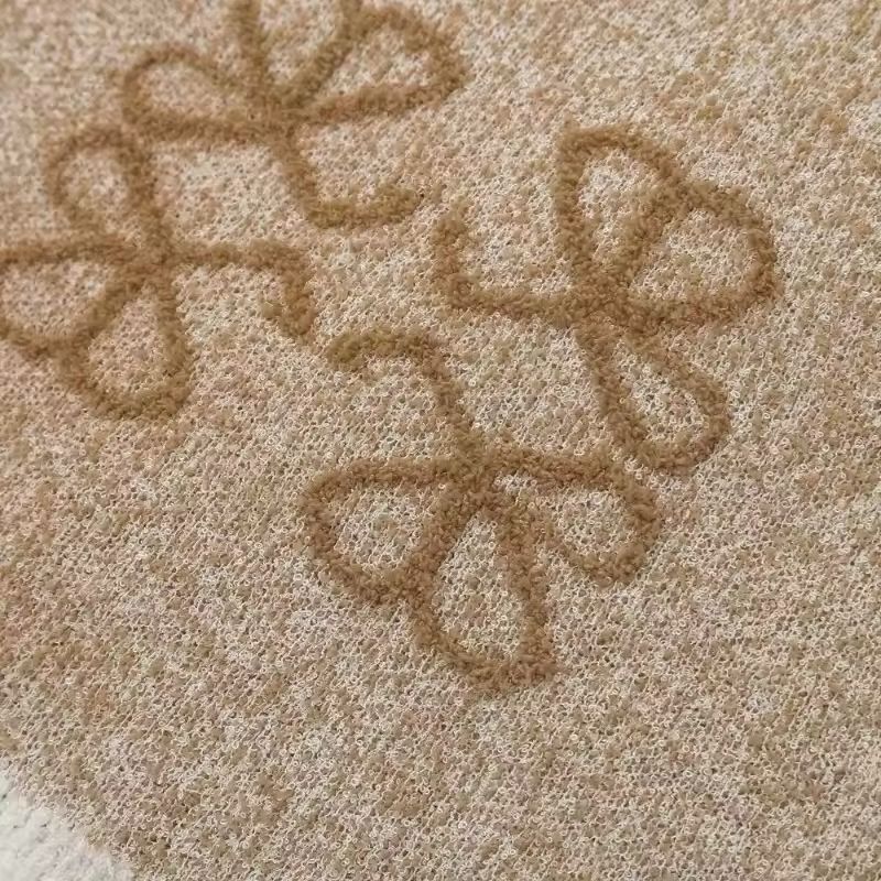 Close-up of jacquard texture and soft knit fabric – feminine vintage-style sweater vest
