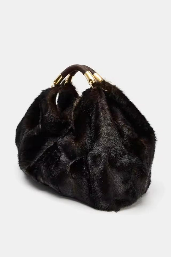 Elegant plush winter handbag in chocolate brown faux fur with gold metal details, perfect fall and winter fashion accessory.
