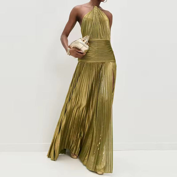 Side view of elegant pleated metallic maxi dress in olive-gold, featuring thigh-high slit and halter neckline, showcasing flowy movement and glamour.