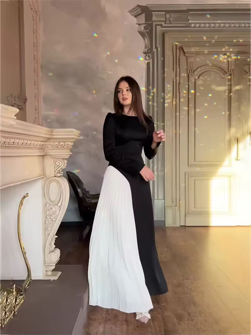 Chic monochrome evening dress with fitted waist and pleated white insert, luxury minimalist fashion
