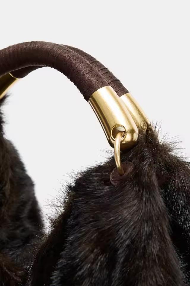 Elegant plush winter handbag in chocolate brown faux fur with gold metal details, perfect fall and winter fashion accessory.
